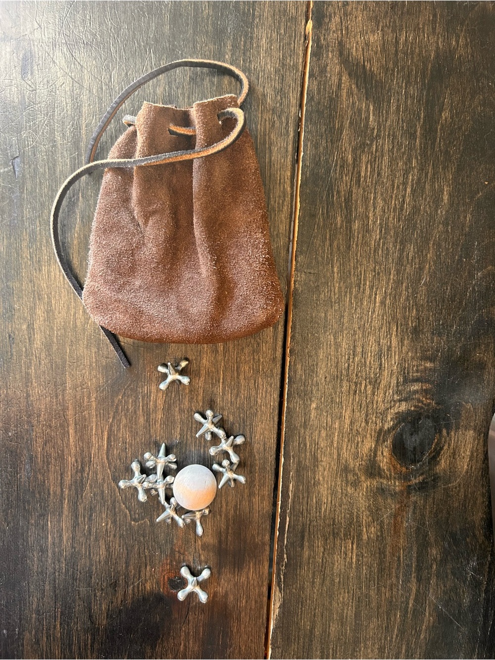 Vintage Brown Jacks Game Suede Drawstring Pouch with metal jacks and wooden ball